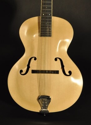 A guitar with a wooden body and a wooden neck.