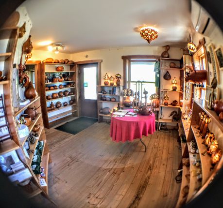 A fish eye view of a room full of pottery.