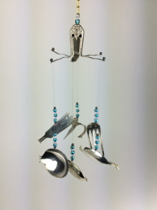 A wind chime made of silver spoons and beads.