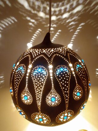 A pendant light with a blue and brown pattern.