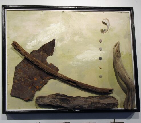 A painting of a piece of wood and a piece of driftwood.