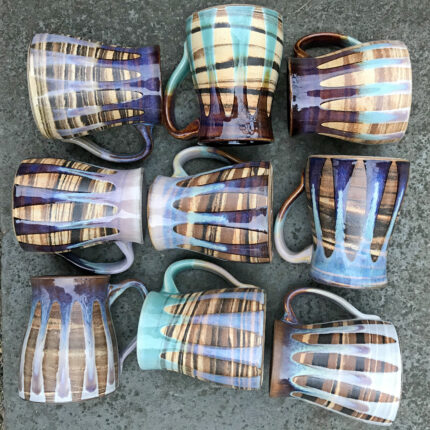 A group of mugs with different colors and patterns.